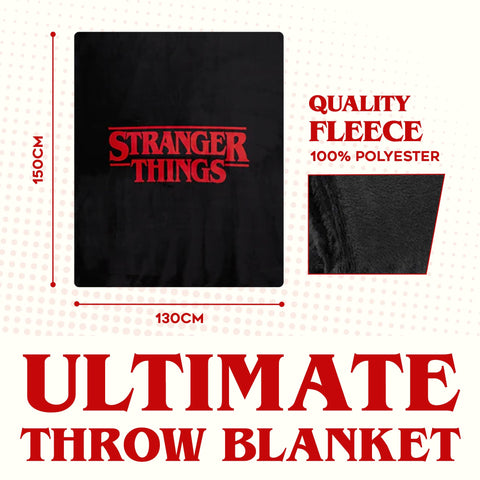 Stranger Things blanket draped on couch creating a themed cozy binge-watching setup