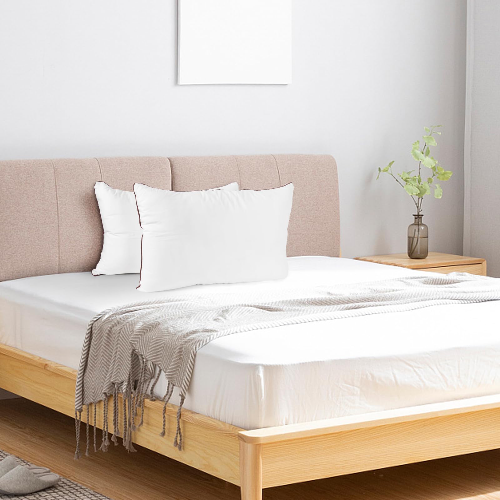 Subrcamos four pillows stacked on bed showing matching set for multi-bed setup
