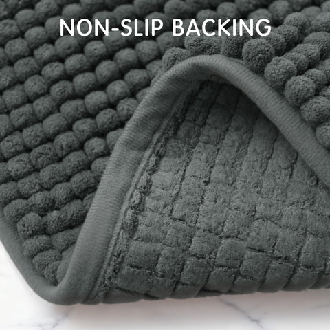 SUBRTEX rug placed outside shower showing absorbency benefit