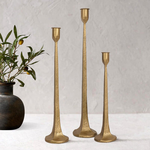 SUJUN front view of three cast iron candlesticks showing elegant silhouette and balance