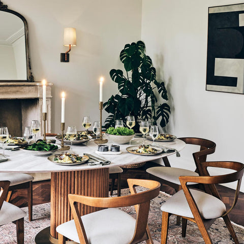 SUJUN candle holders in dining centerpiece creating warm layered lighting