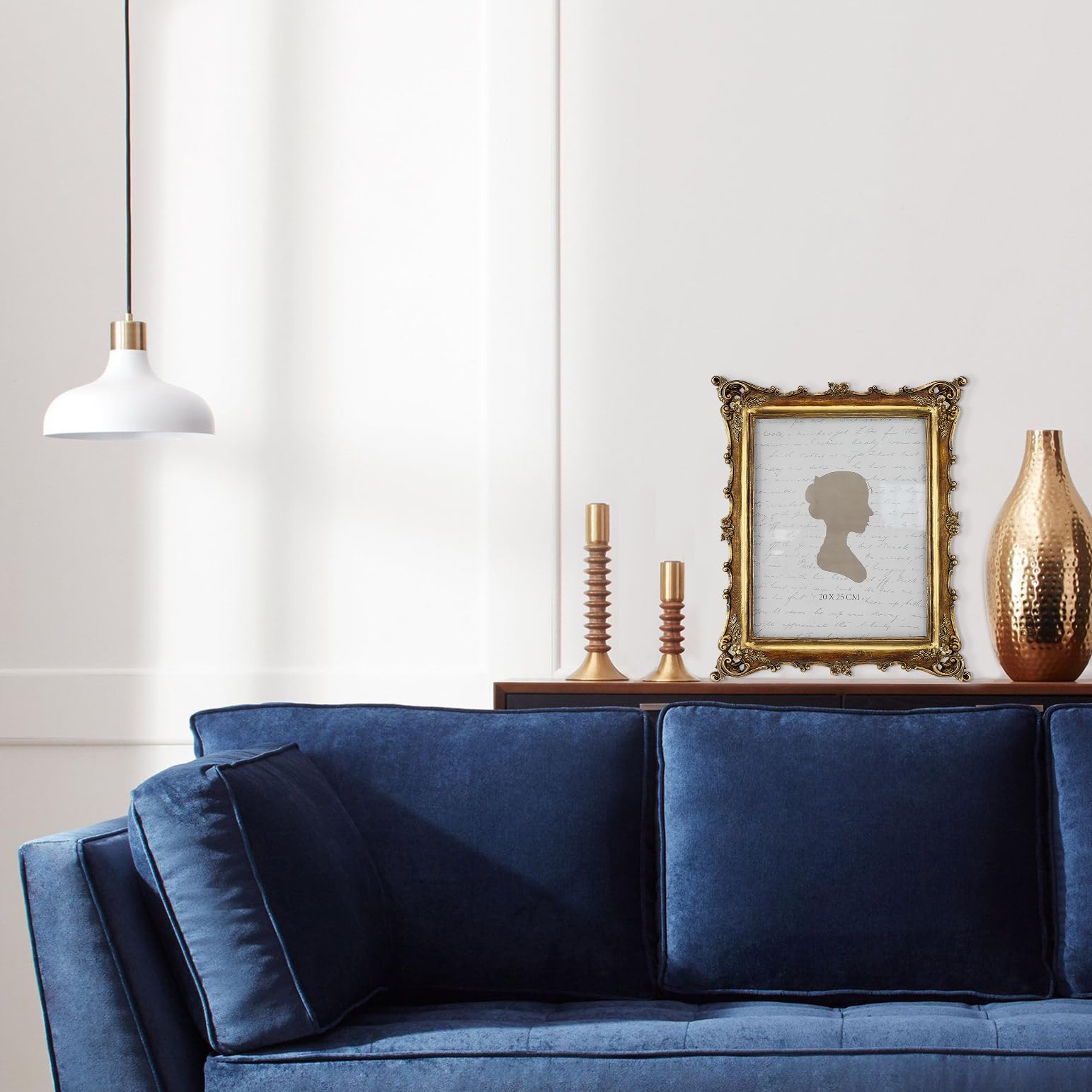 Sunlit frame styled on mantel adding antique charm to room decor