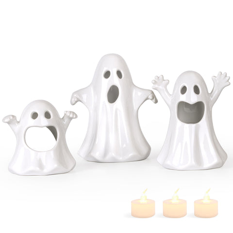 Sunlit front view of three ceramic ghosts on table showing elegant Halloween decor benefit