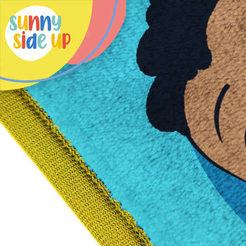 Sunny Side Up CoComelon blanket arranged in stroller for warm on-the-go naps