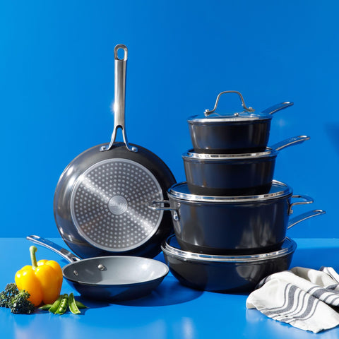 Sur La Table cookware beside measuring cup and spoon to show real-world size and capacity