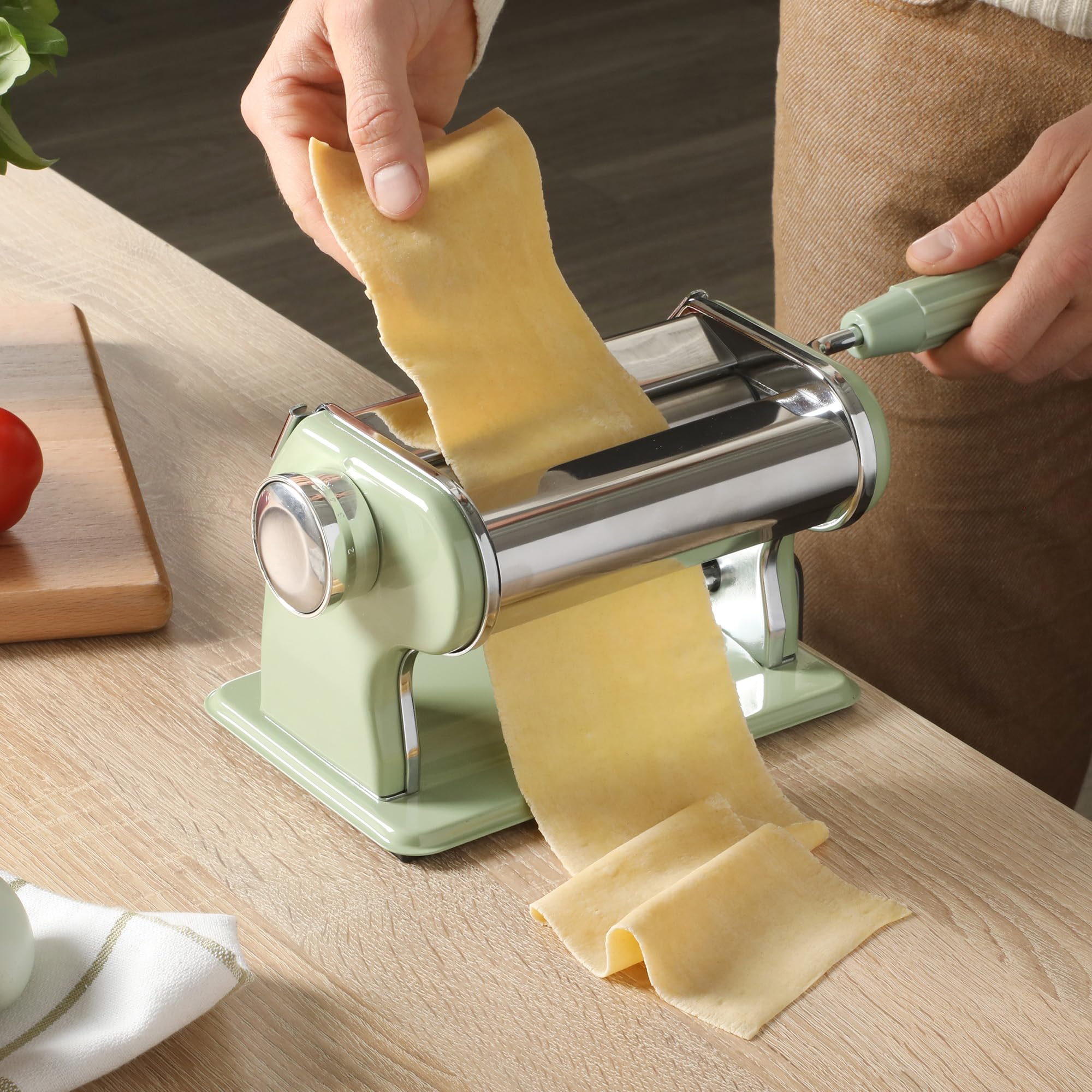 Sur La Table hand turning roller producing a smooth pasta sheet for even cooking