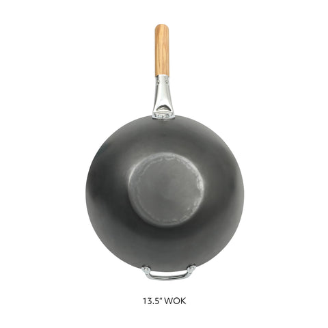 Sur La Table wok on stovetop illustrating flat base contact for fast, even heat transfer