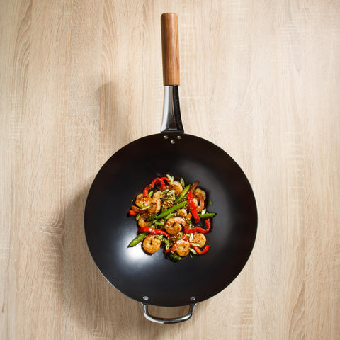 Sur La Table wok beside utensils showing 13.5-inch scale for family-sized stir-fries