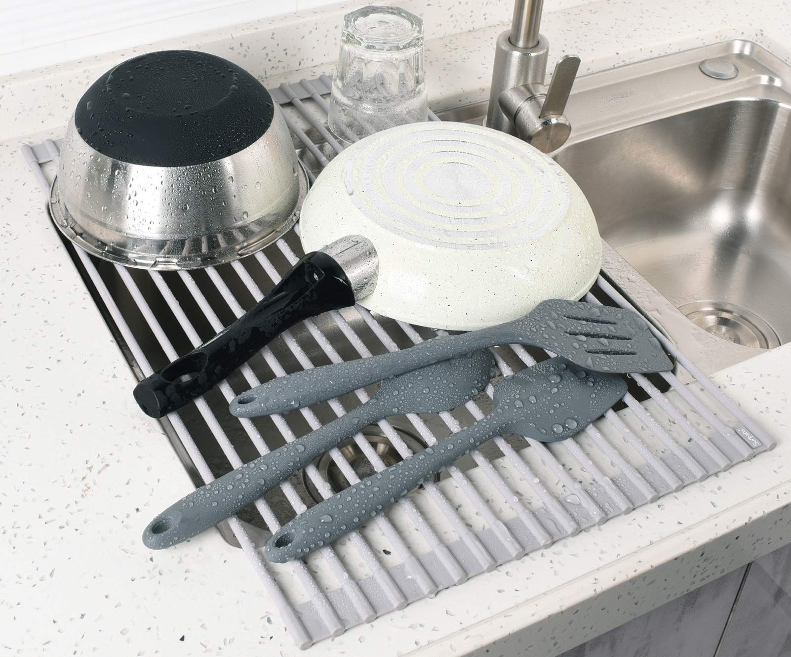Surpahs installed across sink left-to-right saving counter space