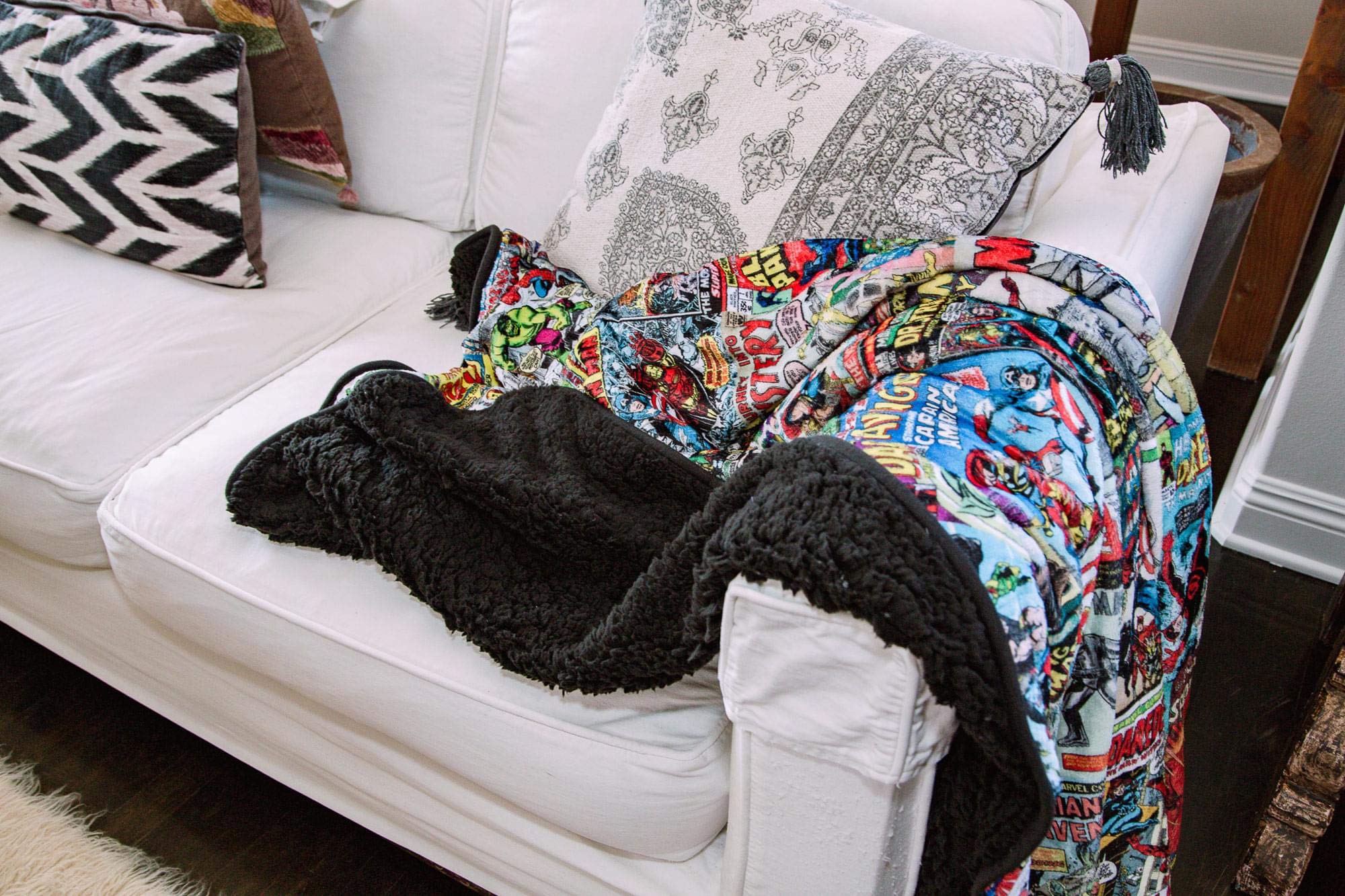 Surreal Entertainment blanket draped on couch in use, comfortable fandom decor