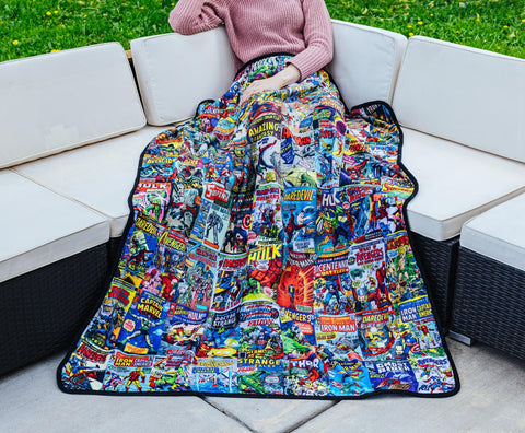 Surreal Entertainment blanket draped on sofa adding Marvel style and cozy seating comfort