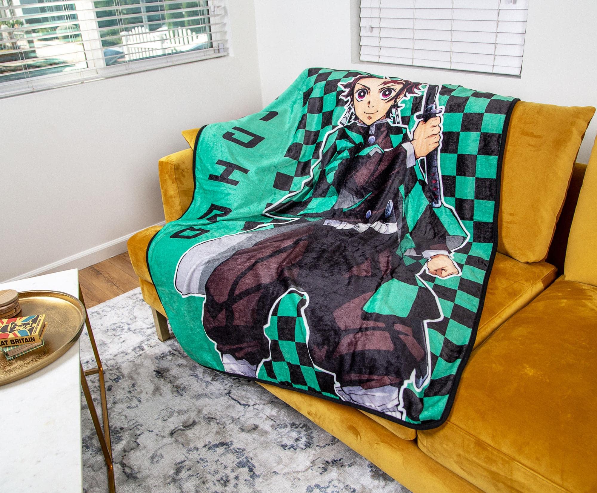 Surreal Entertainment folded throw showing 45x60 size and easy travel portability
