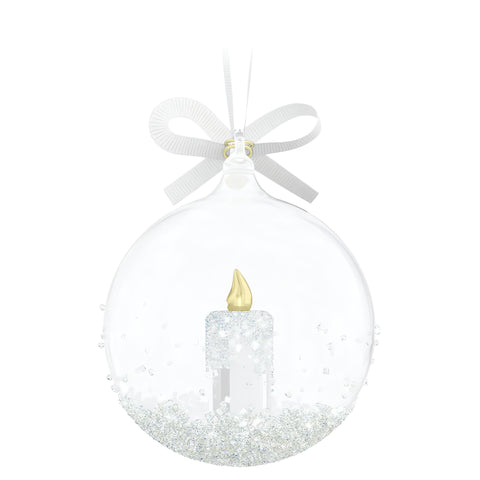 Swarovski ornament hanging on a Christmas tree creating festive, refined ambiance
