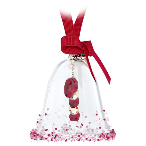Swarovski Dulcis Bell held in hand showing size and collectible holiday ornament detail
