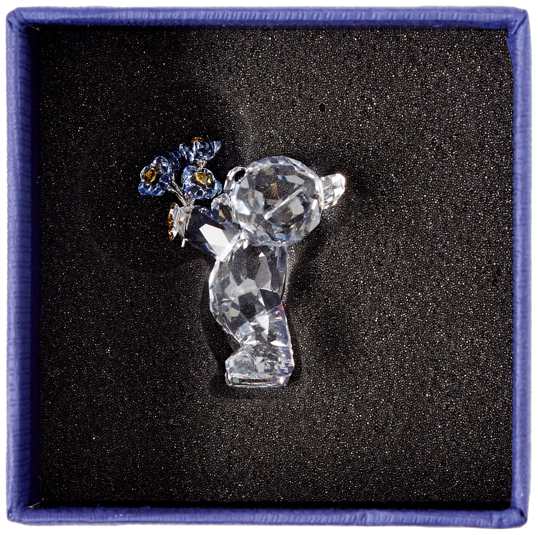 Swarovski Kris Bear in hand for scale demonstrating compact collectible size