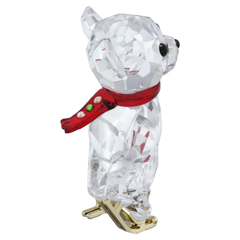Swarovski Kris Bear beside a coin to show compact size and display versatility