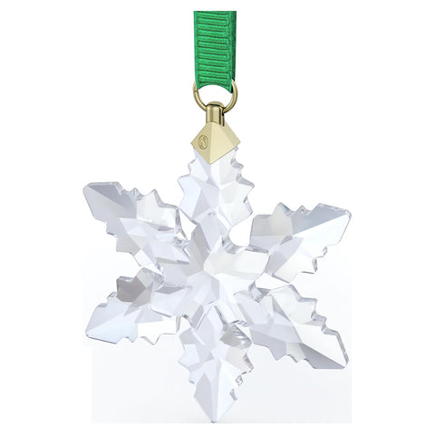 Swarovski ornaments hanging on a holiday tree adding luminous festive atmosphere