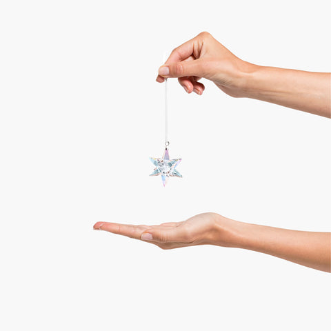 Swarovski facet close-up revealing precise cuts and intense light refraction benefit