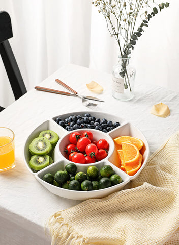 Sweese serving set in use with snacks showing organized table benefit