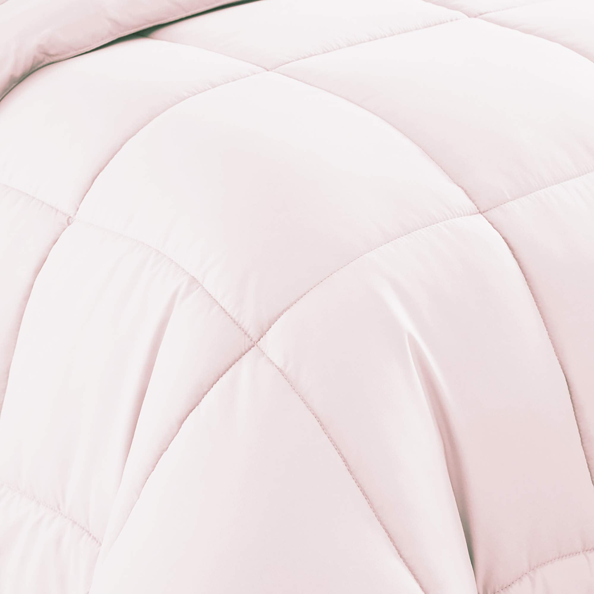 Sweet Home Collection comforter arranged on bed in lifestyle room conveys warmth and modern bedroom styling