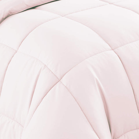 Sweet Home Collection comforter arranged on bed in lifestyle room conveys warmth and modern bedroom styling