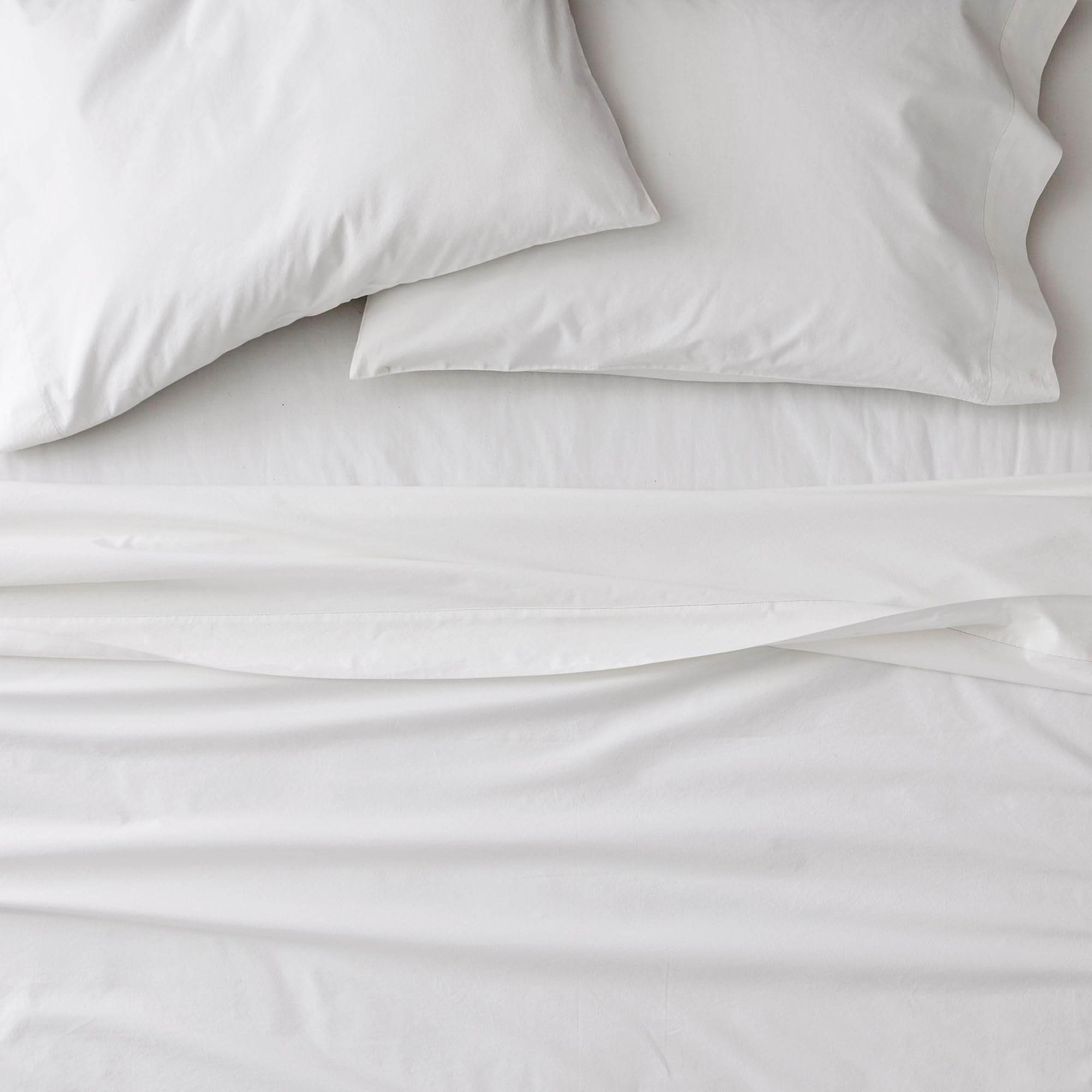 Sweet Home Collection folded pillowcases and sheets showing coordinated layering convenience