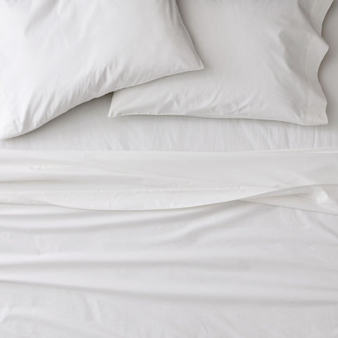 Sweet Home Collection folded pillowcases and sheets showing coordinated layering convenience