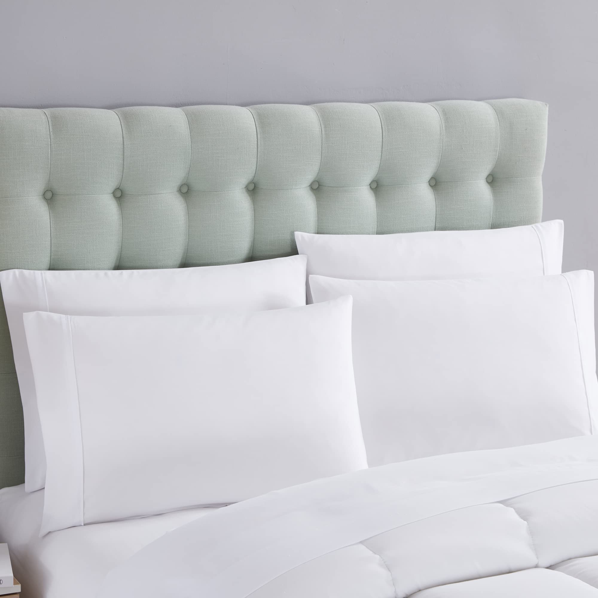 Sweet Home Collection pillowcases and flat sheet staged to show smooth, wrinkle-resistant finish
