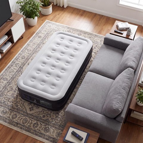 Sweetcrispy mattress next to chair for scale showing twin size dimensions and height