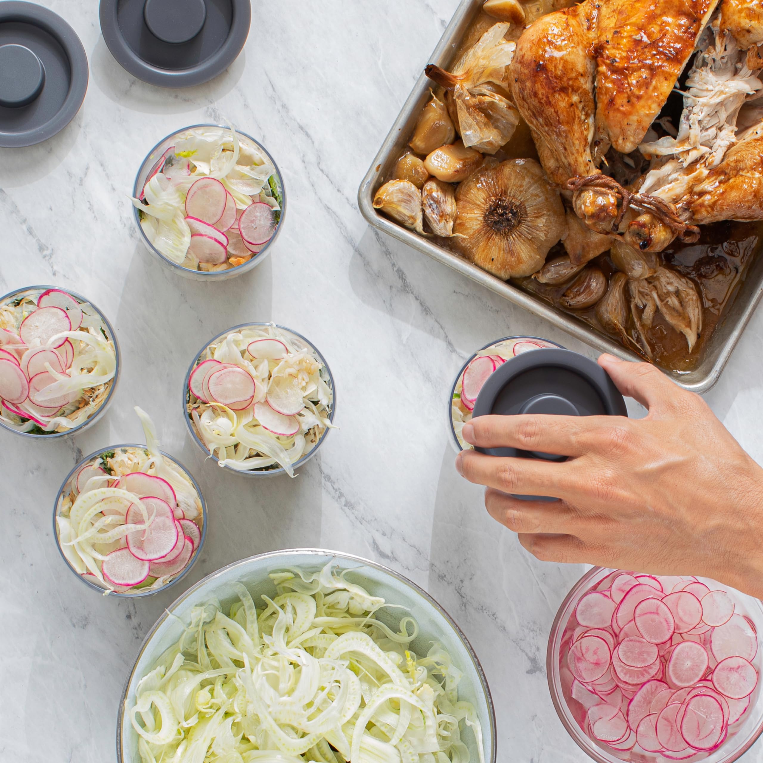S'well bowls on kitchen counter with prepped ingredients highlighting effortless meal prep