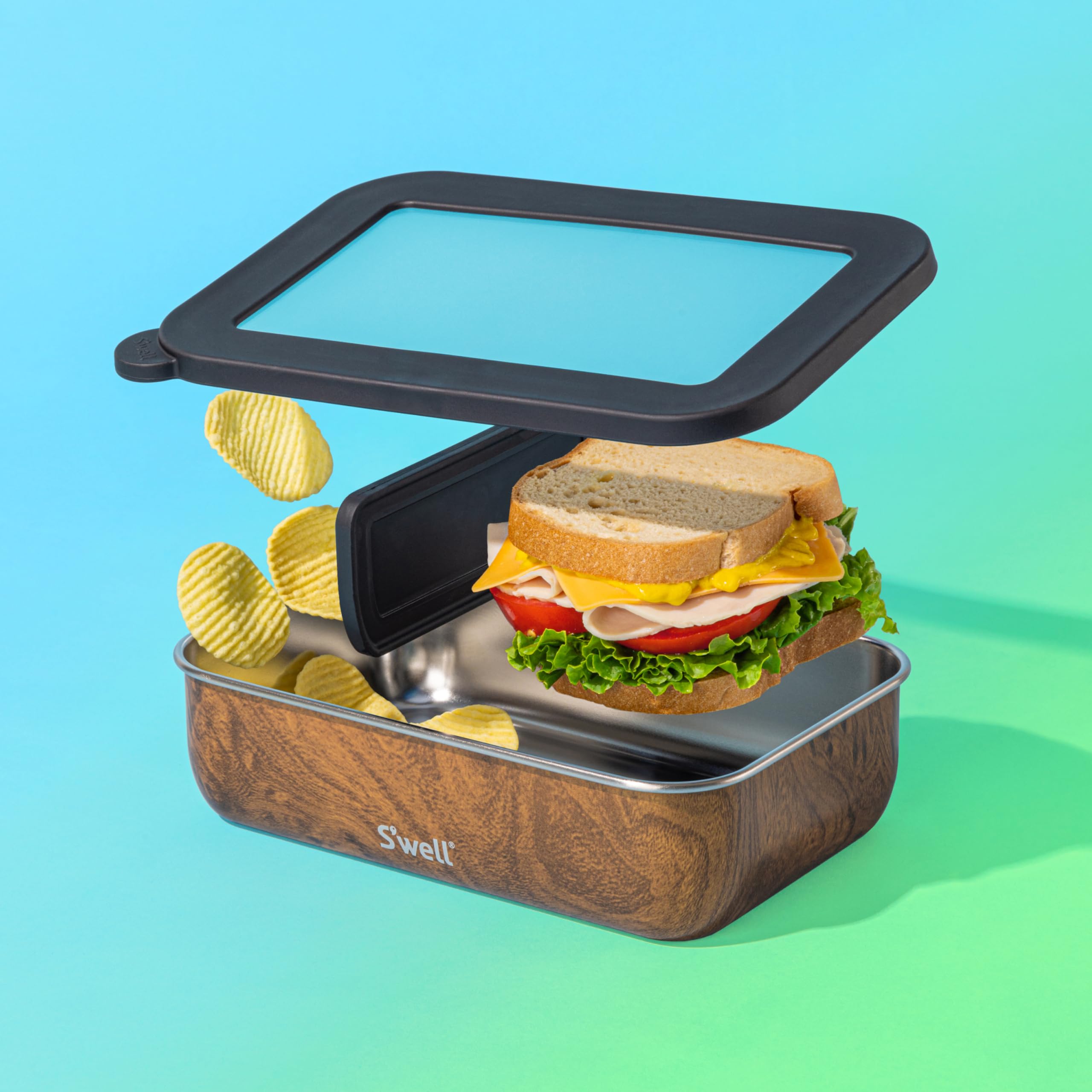 S'well bento next to utensils showing scale and portion-friendly capacity