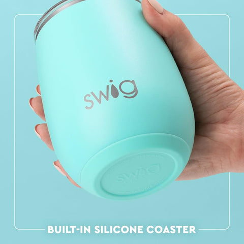 Swig Life Caliente on a beach towel with sunglasses, perfect for outdoor, no-glass zones