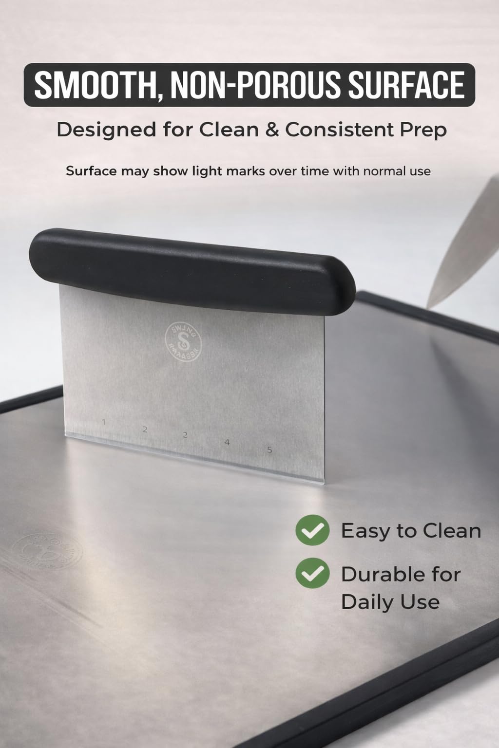Swing & Swagger board next to chef knife to show scale and generous 16x11-inch prep area benefit