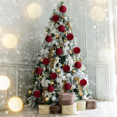 Syhood burgundy balls arranged on mantel with garland giving festive cohesion