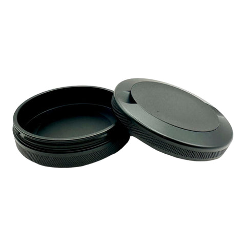 Syn Tin open showing dual compartments and O-ring benefit: organized storage