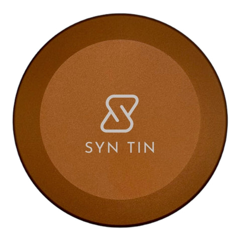 Syn Tin sitting in a pocket demonstrating compact size and easy portability