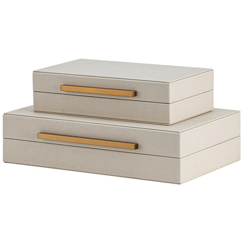 SYYSY box beside book showing scale and space-saving footprint