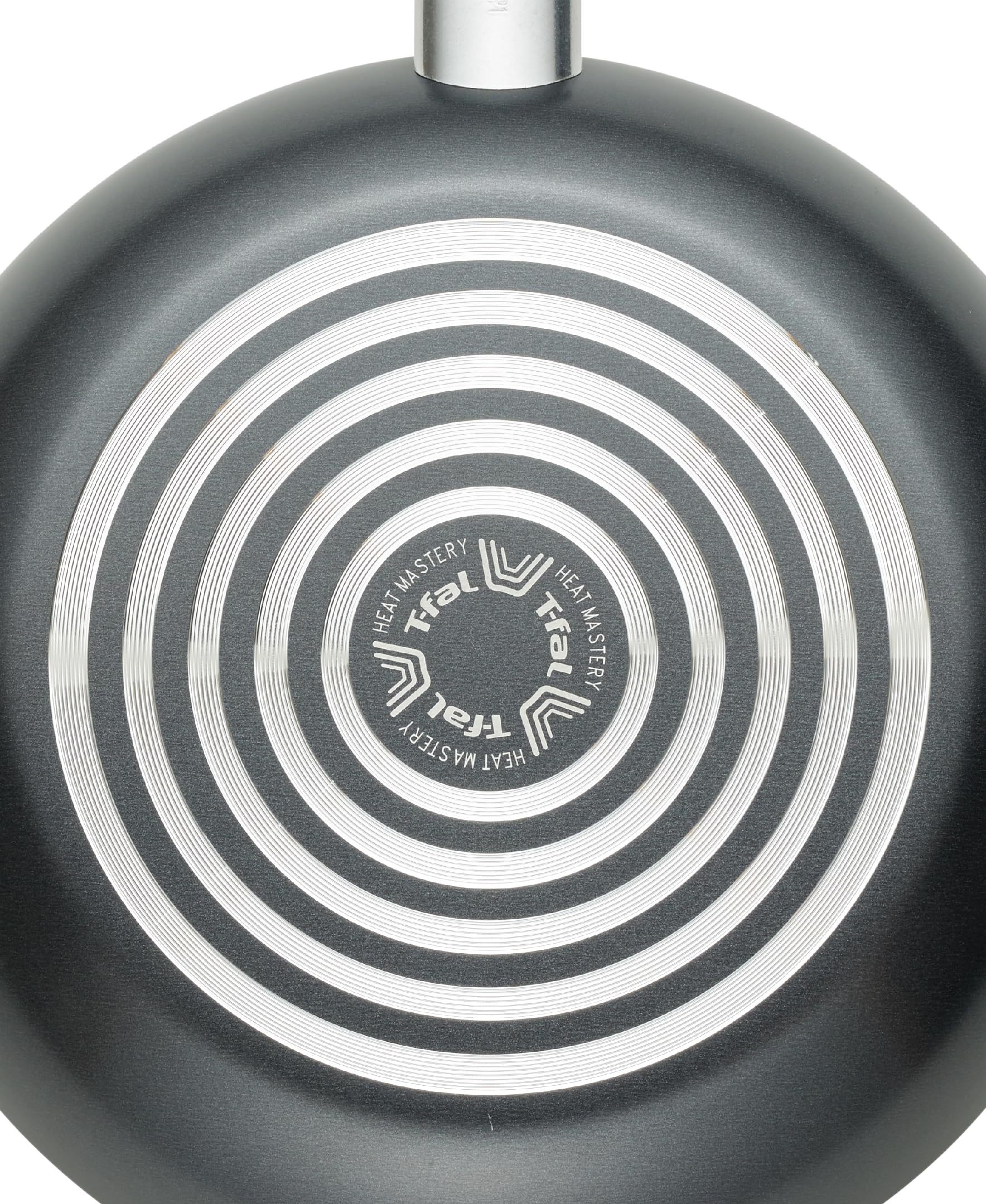 T-Fal frying pan in use on gas stovetop demonstrating even heating and cooking control benefit