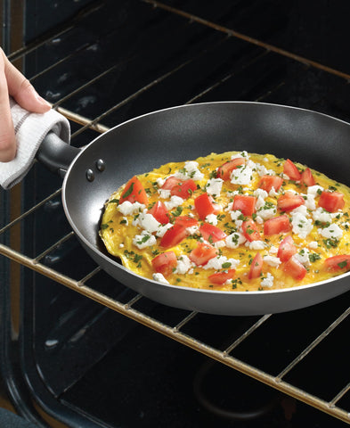 T-Fal vented glass lid close-up showing visibility while trapping heat and moisture benefit