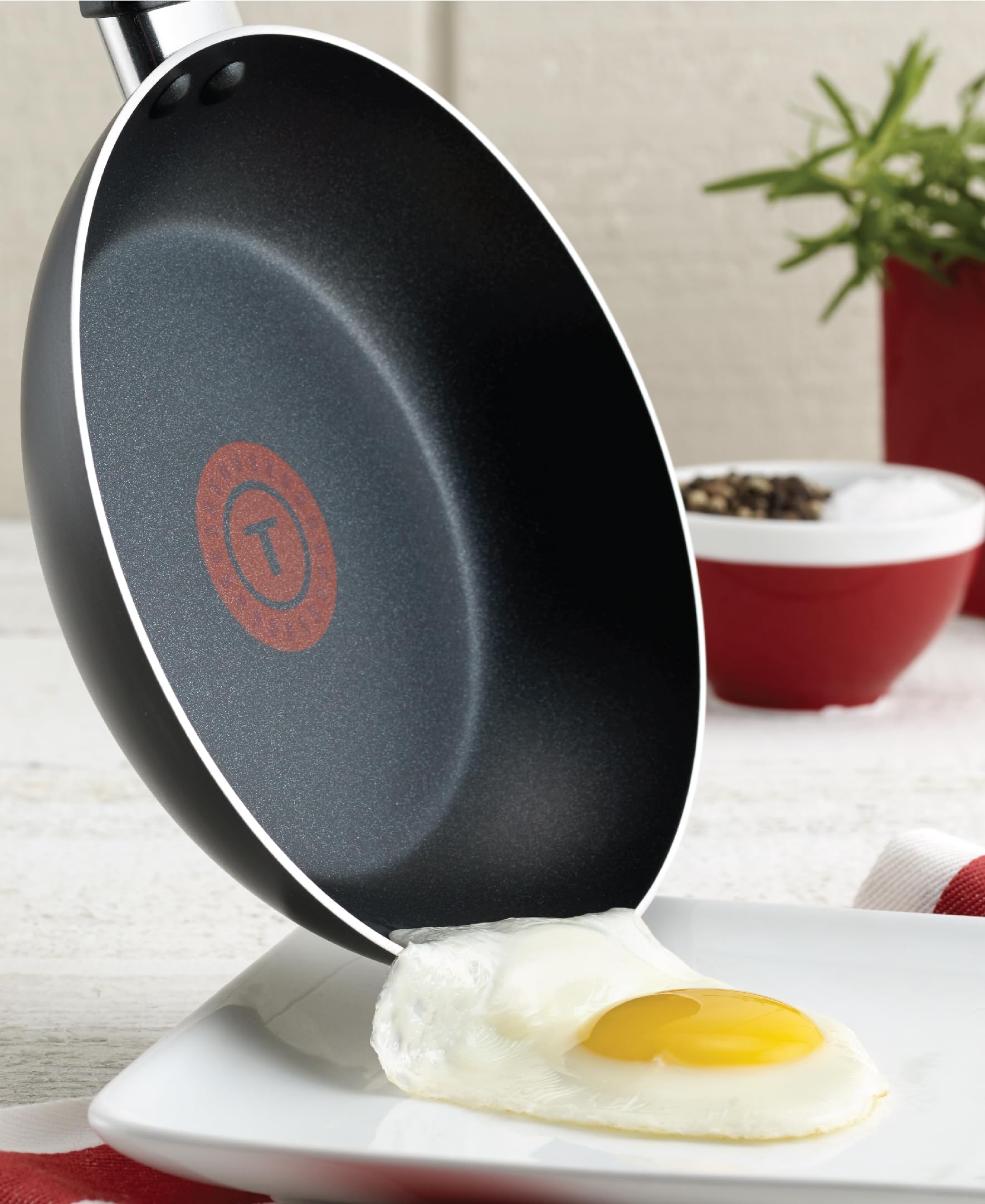 T-Fal saucepan with lid side view demonstrating secure fit and simmering control benefit