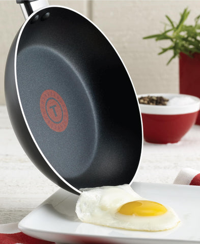 T-Fal saucepan with lid side view demonstrating secure fit and simmering control benefit