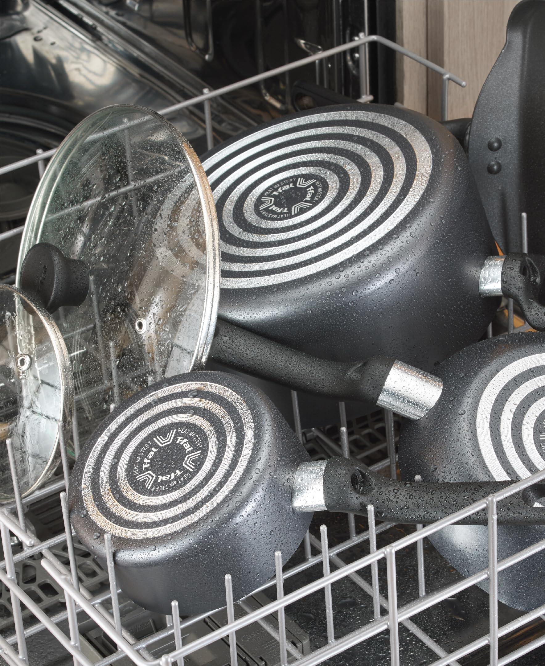 T-Fal pans beside measuring cups to show scale and portioning convenience benefit