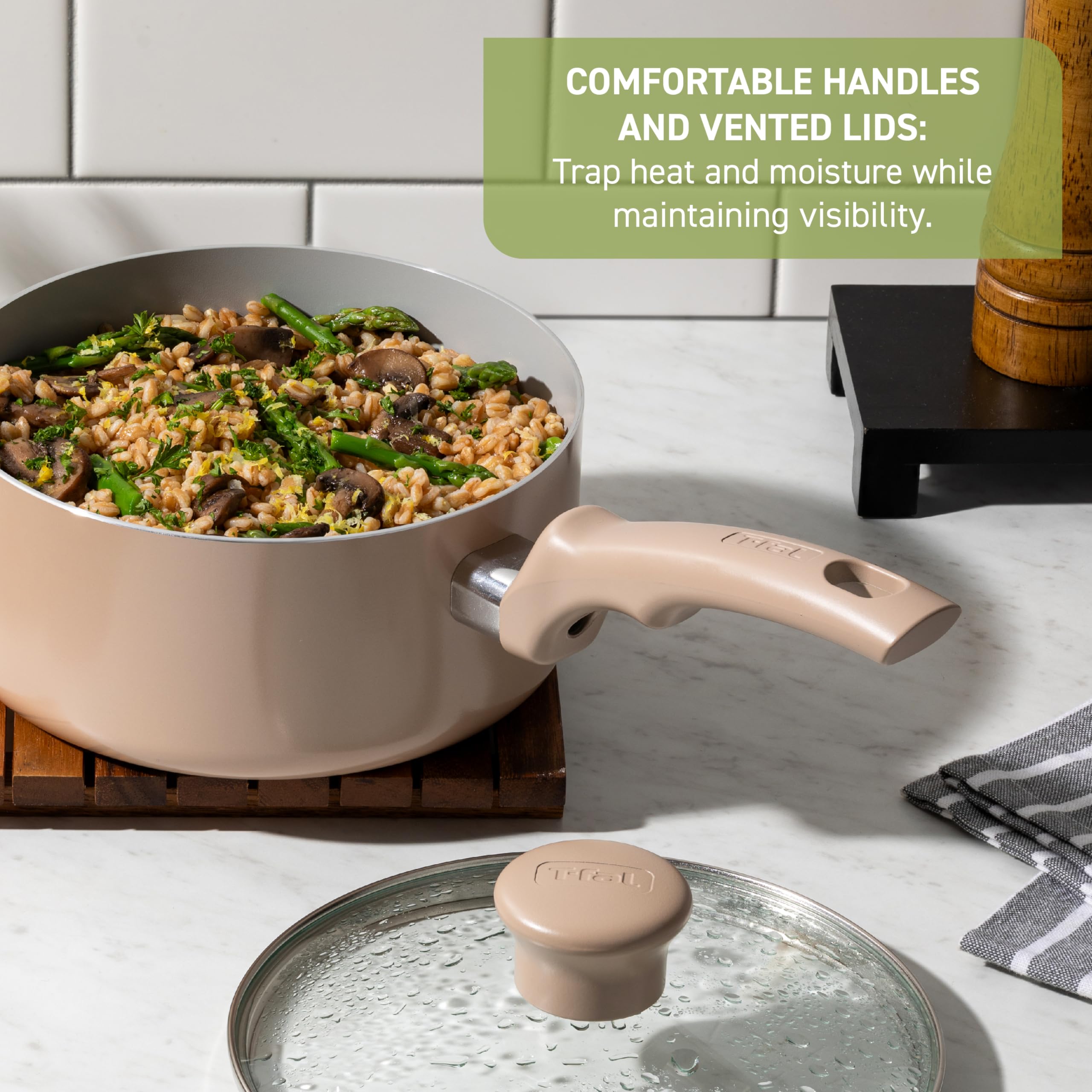 T-Fal comfortable handle close-up, ergonomic grip for secure control while cooking