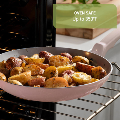 T-Fal skillet in use sautéing vegetables, even heat distribution for consistent results