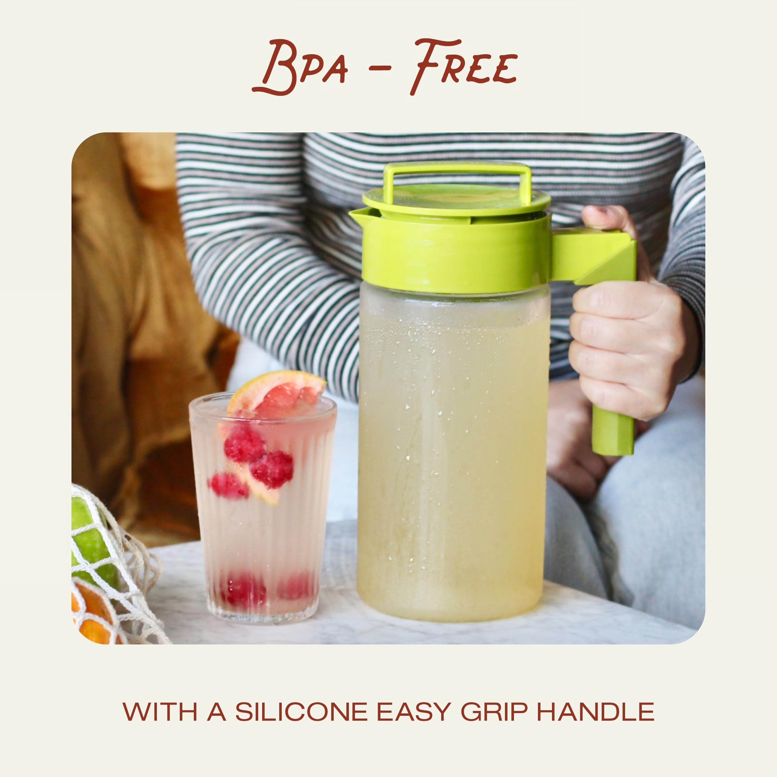 Takeya lid and silicone handle close-up showing secure seal and comfortable grip