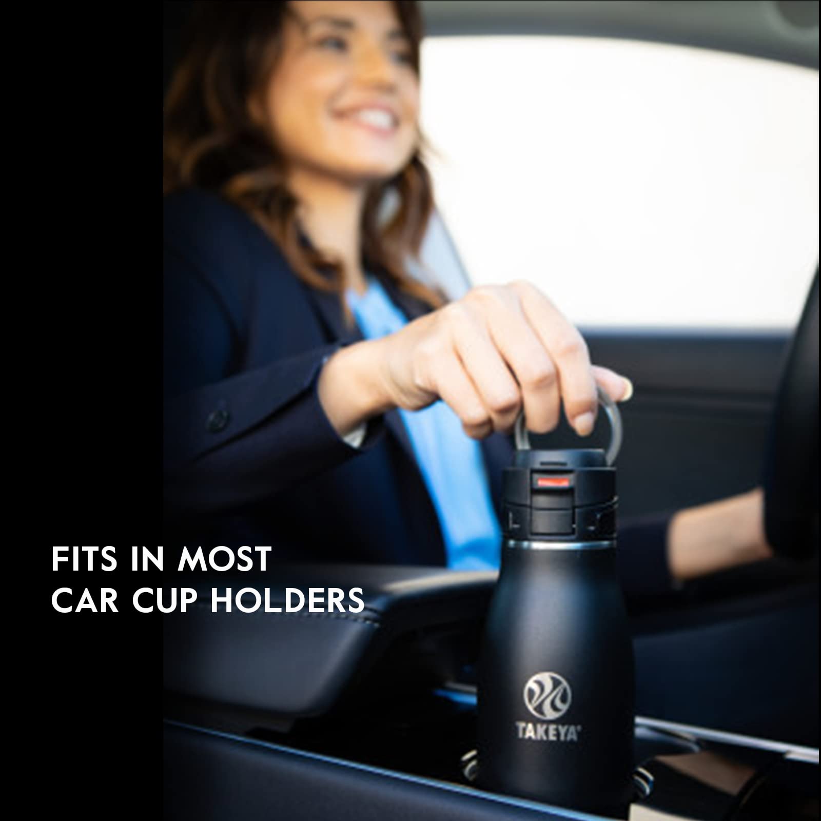 Takeya Traveler held by loop handle illustrating easy grab-and-go portability