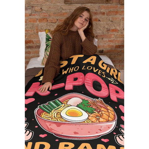 Tamonten blanket wrapped around person reading, provides lightweight warmth