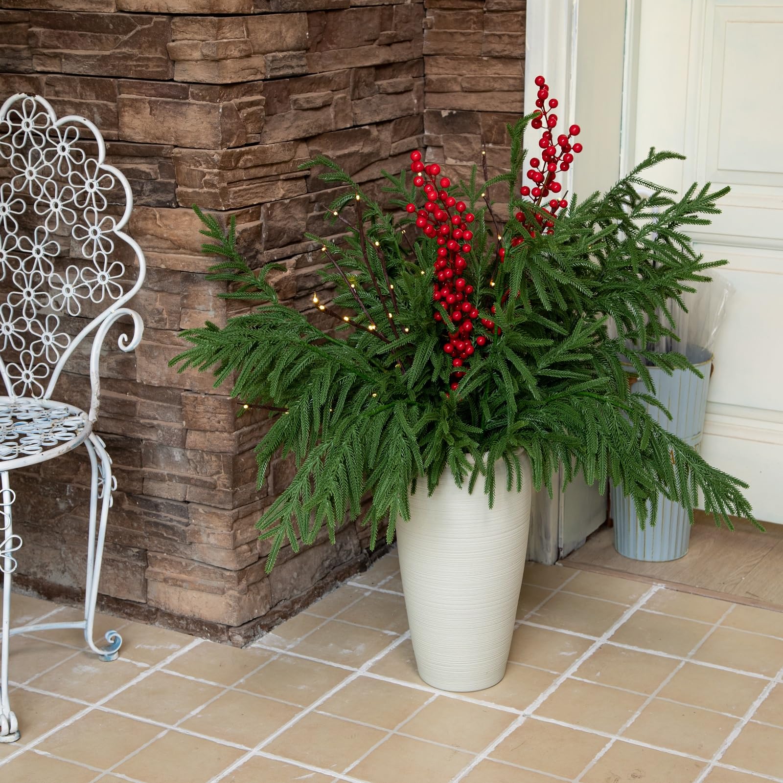 Tasruwat stems styled in a tall glass vase for dramatic entryway decor