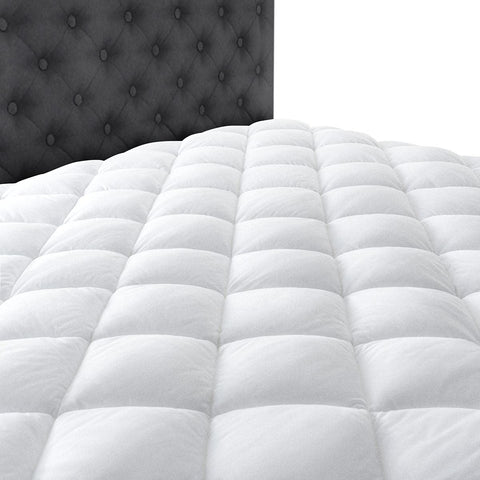 Taupiri pad on full mattress in bedroom scene adding plush layer