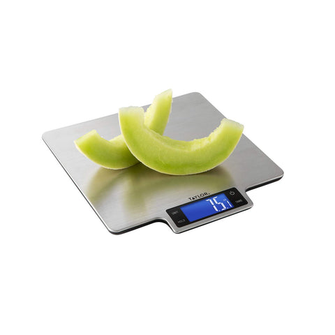 Taylor in use with a mixing bowl demonstrating Hold feature and precise measurement convenience